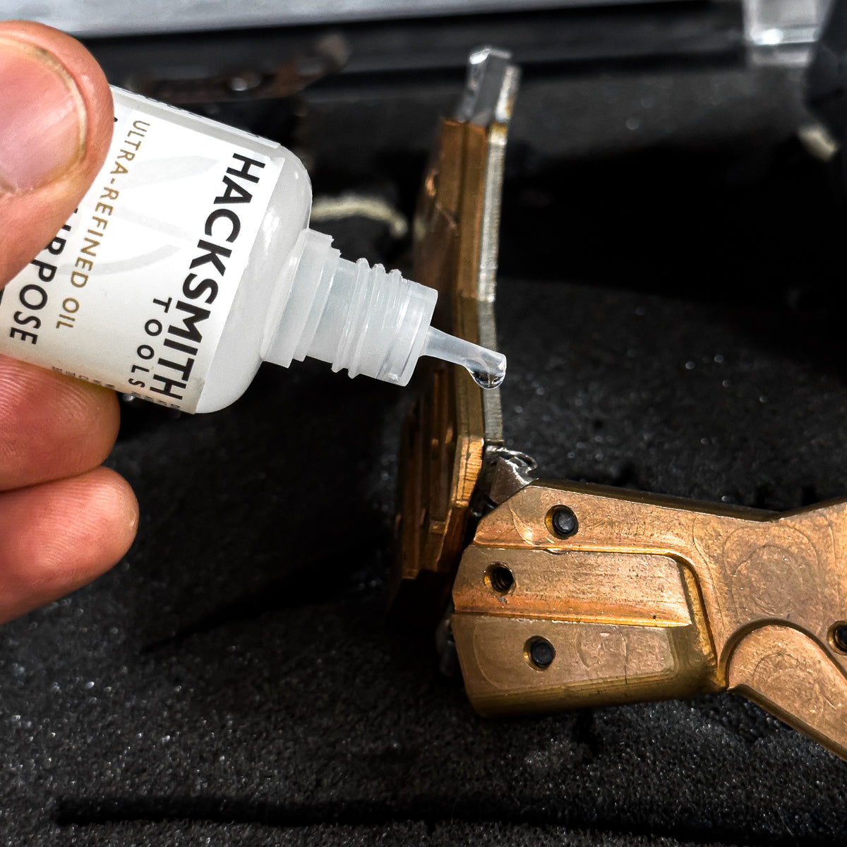 30ml Hacksmith Tools all purpose lubricant bottle with white cap and clear label showing product name and specifications.