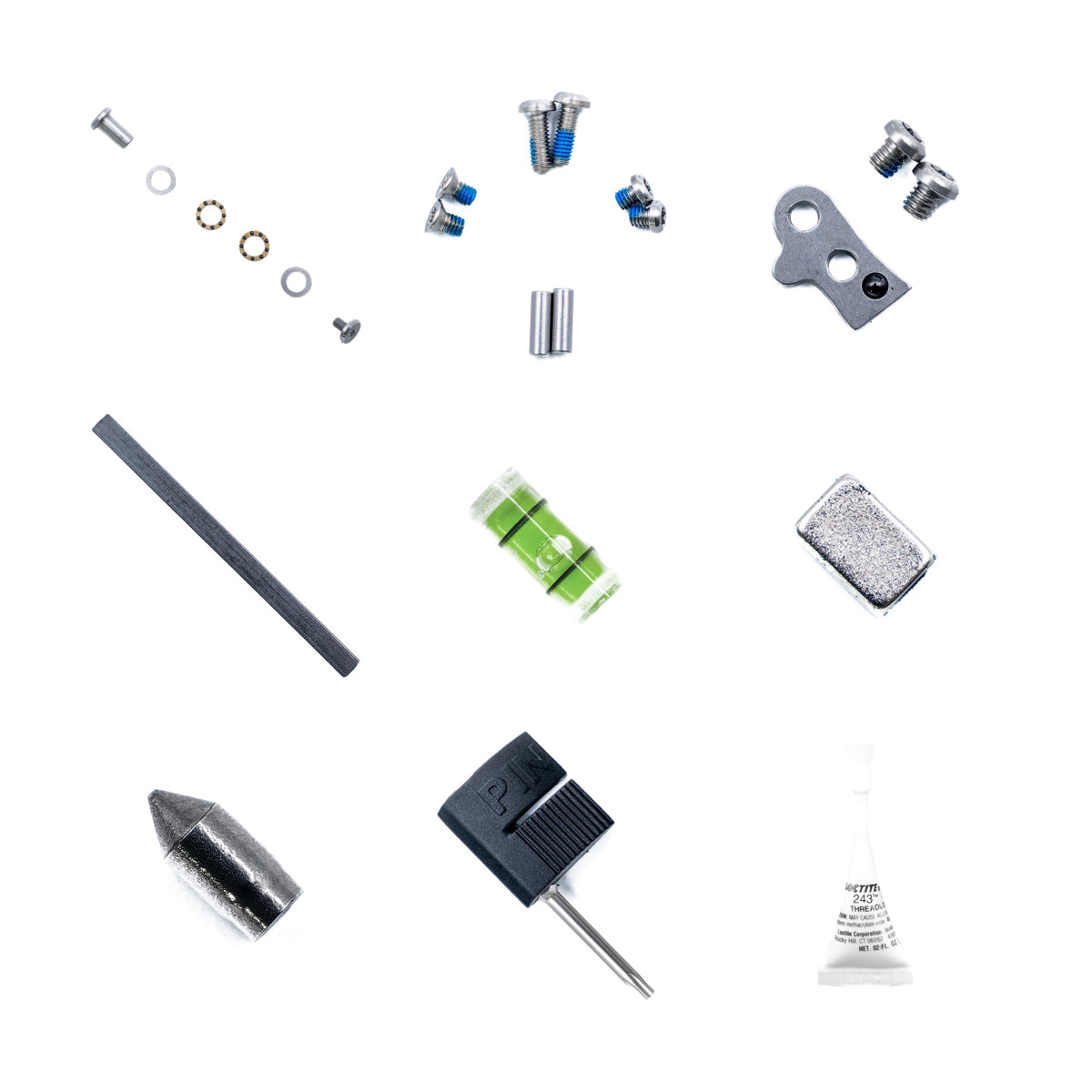 Smith Blade Pro Full Rebuild Kit contents laid out: hinge pin kit, frame screws and dowel pins, detent plate and screws, fire steel, bubble level, socket magnet, glassbreaker and scribe, T8 bit with bit flag, and Loctite threadlocker