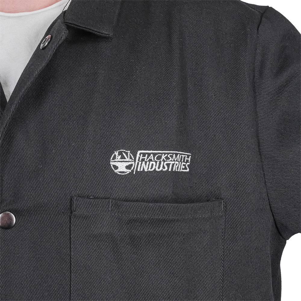 Fire-resistant shop coat from Engineered By Hacksmith, durable workwear with safety features, shown in XS size.