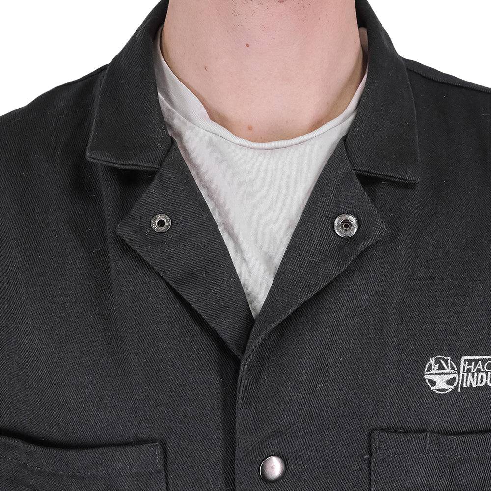 Fire-resistant shop coat by Engineered By Hacksmith, lightweight workwear with durable fabric and safety features, shown in a close-up image.