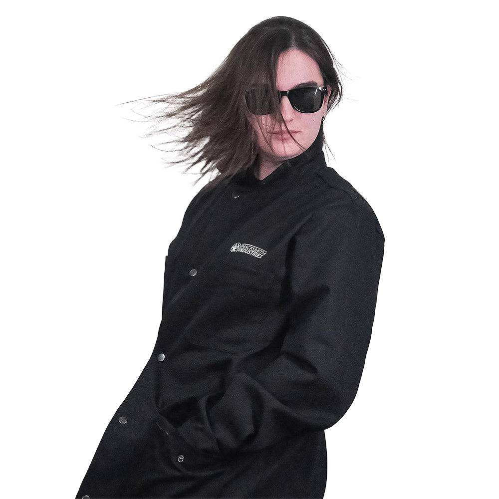 Fire-resistant shop coat by Engineered By Hacksmith, lightweight workwear with long sleeves and durable fabric for industrial safety.