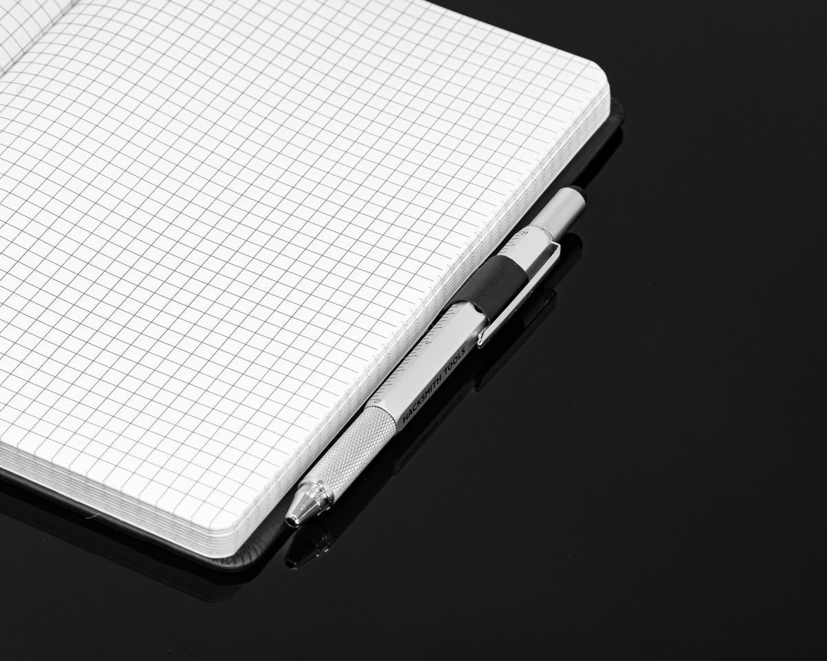 Engineered By Hacksmith inventor's notebook with lined pages, spiral binding, and custom cover design for creative engineering ideas.